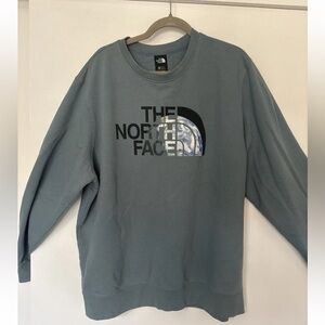 The North Face Men's Crewneck Sweatshirt in Dusty Blue with Logo Earth Graphic